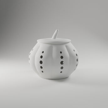 Perforated Pumpkin Luminary in white, 3D printed — studio render