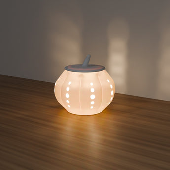 Perforated Pumpkin Luminary glowing with an LED light — render
