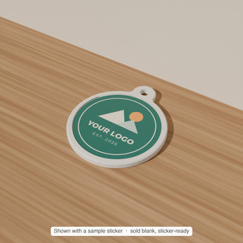 Round Keychain Blank with a sample sticker applied — render